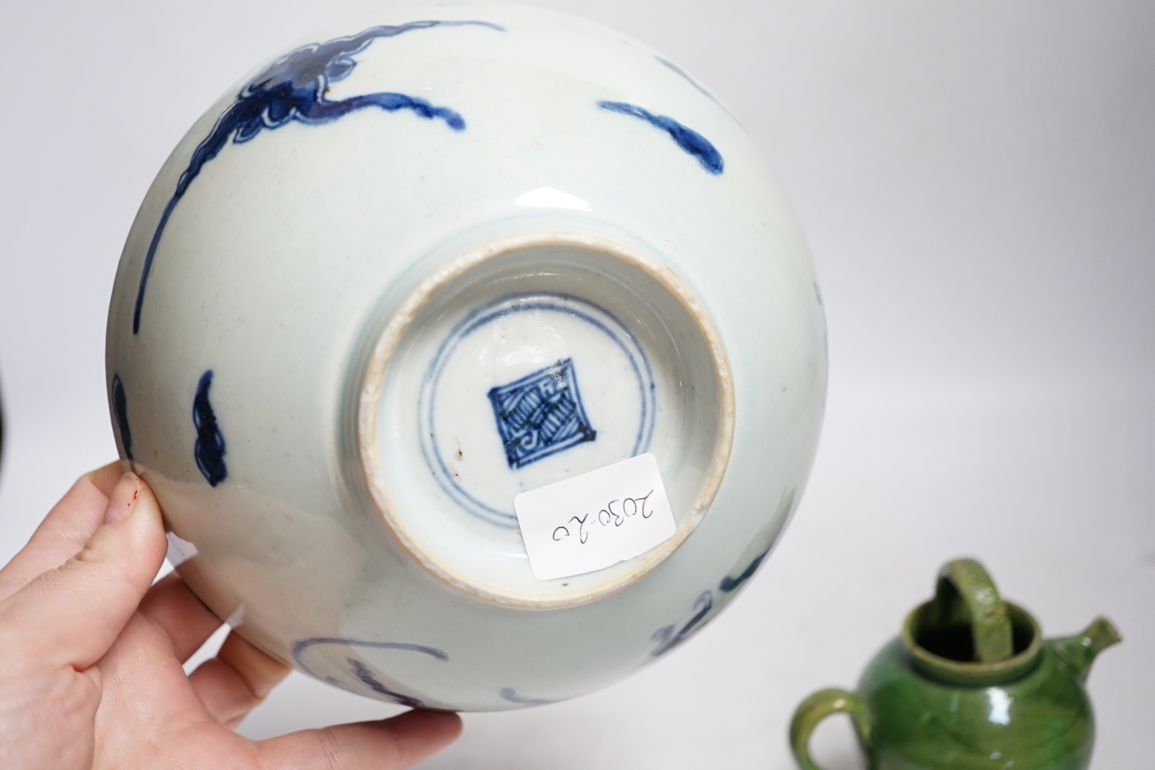 A Chinese blue and white ‘dragon’ bowl and a green glazed water pot, bowl 17.5cm diameter